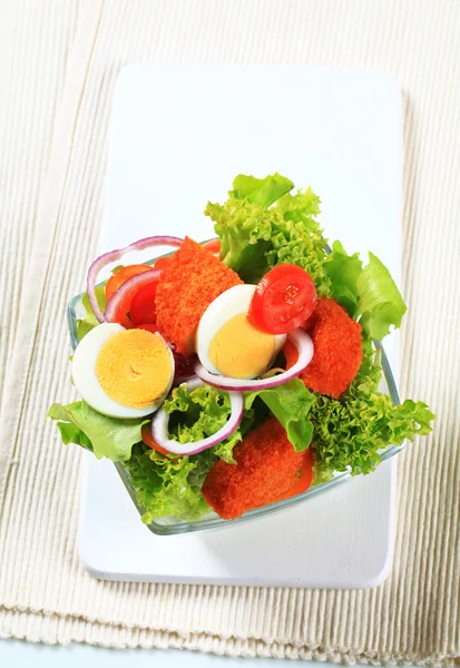 Fresh salad with fried breaded cheese and egg — Stock Photo, Image