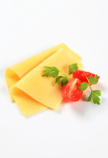 Sliced cheese and tomato wedges — Stock Photo, Image