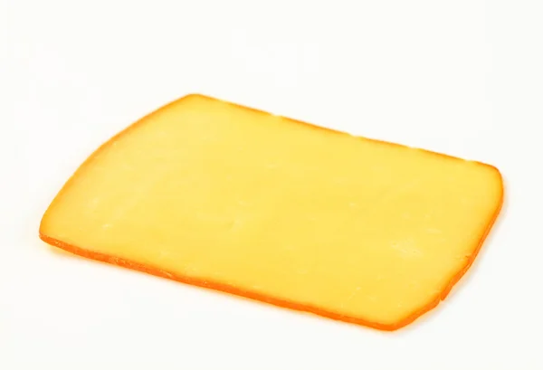 Slice of smoked cheese — Stock Photo, Image