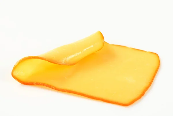 Slice of smoked cheese — Stock Photo, Image