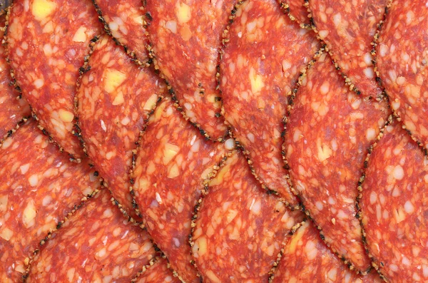 Black pepper-coated salami with cheese — Stock Photo, Image