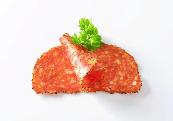 Black pepper-coated salami with cheese — Stock Photo, Image