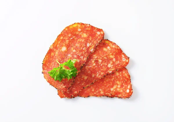 Black pepper-coated salami with cheese — Stock Photo, Image