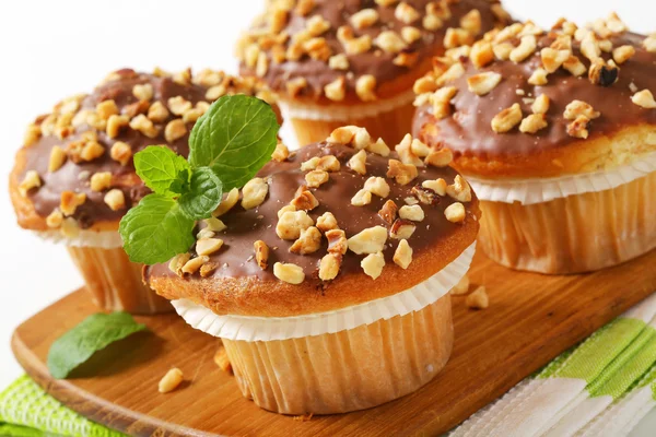 Chocolate glazed muffins — Stock Photo, Image