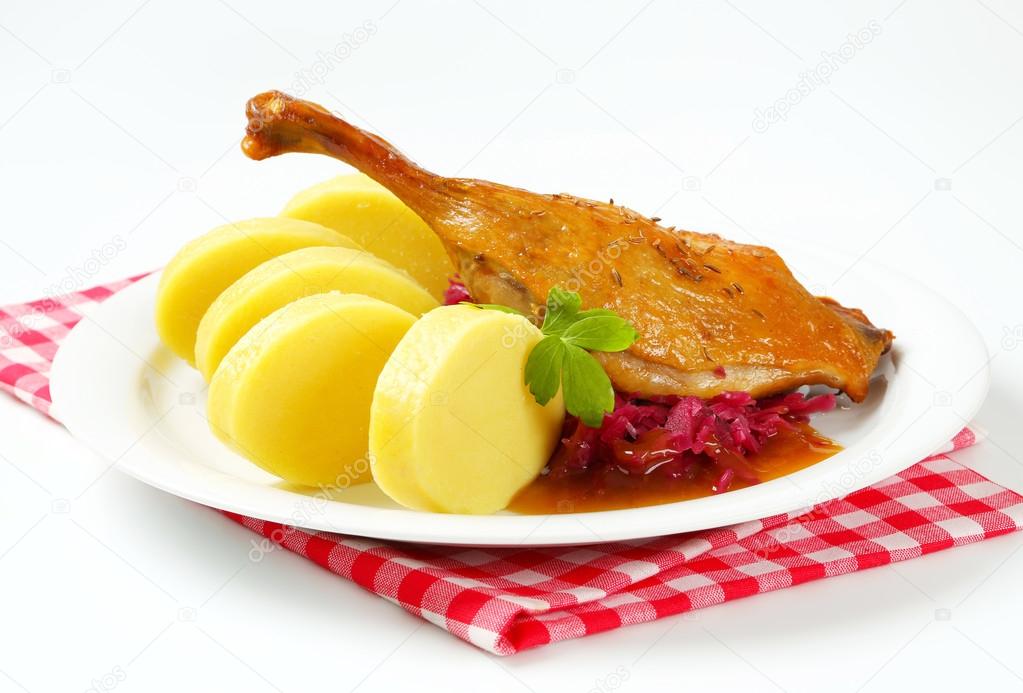 Roast duck with potato dumplings and red cabbage