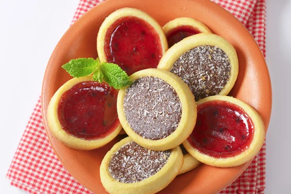 Jam  and chocolate filled tartlets — Stock Photo, Image