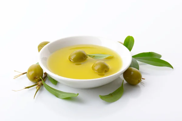 Pitted green olives and oil — Stock Photo, Image