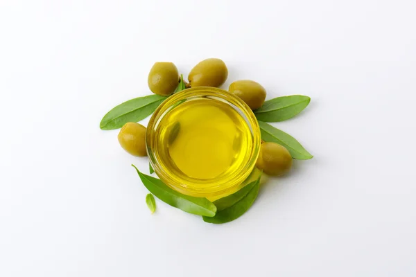 Olive oil and green olives — Stock Photo, Image