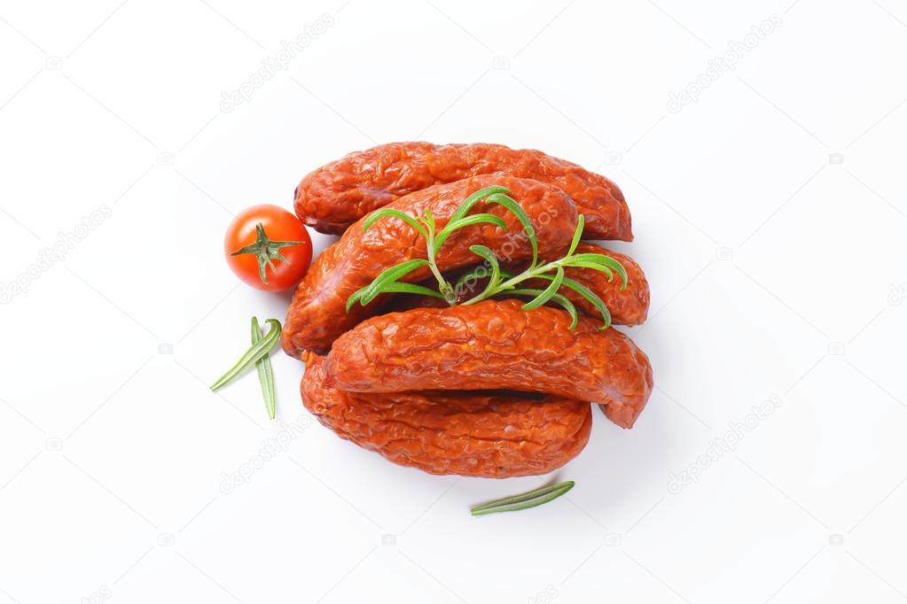 Kielbasa sausages on white background Stock Photo by ©ajafoto 79475812