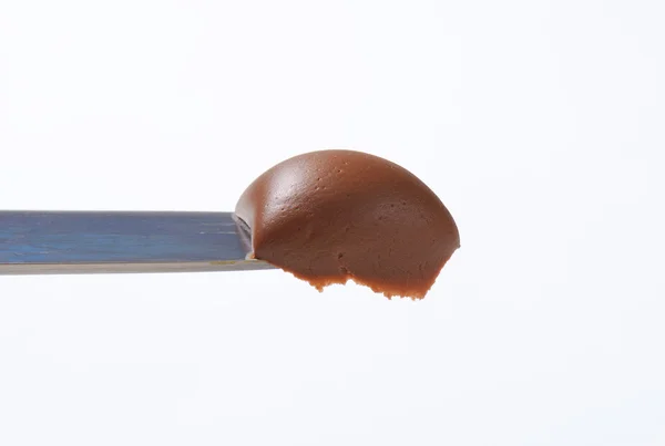 Chocolate spread on knife — Stock Photo, Image