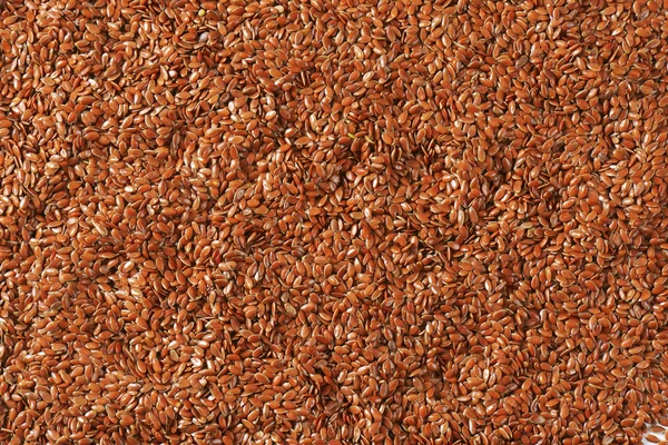 Brown flax seeds background — Stock Photo, Image