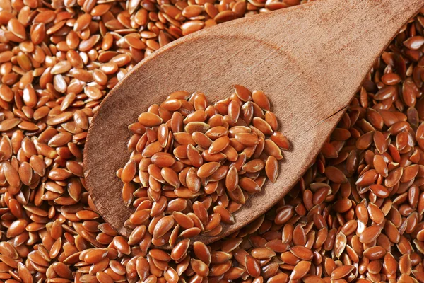 Brown flax seeds background — Stock Photo, Image