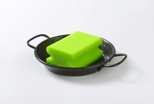 Kitchen sponge on skillet — Stock Photo, Image