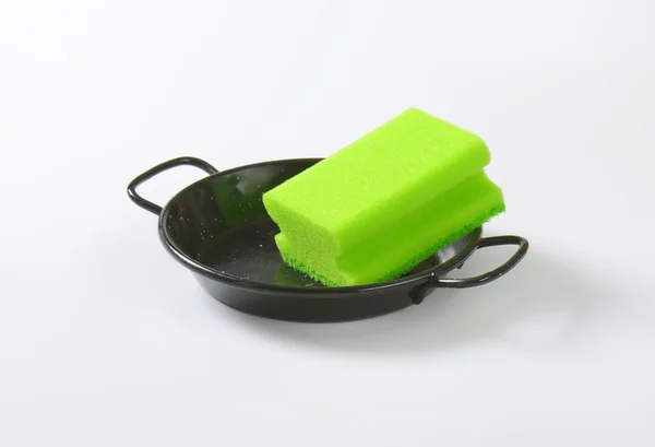 Kitchen sponge on skillet — Stock Photo, Image