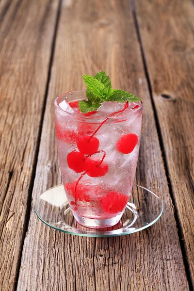 Iced drink with maraschino cherries — Stock Photo, Image