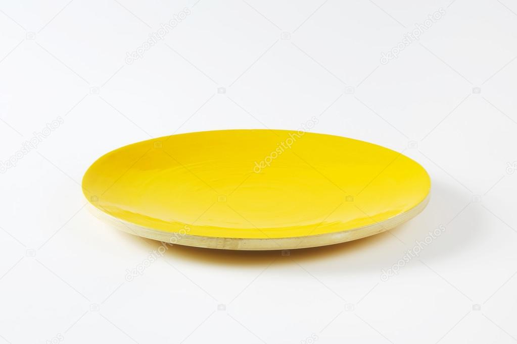 Rimless round yellow plate — Stock Photo © ajafoto 84017456