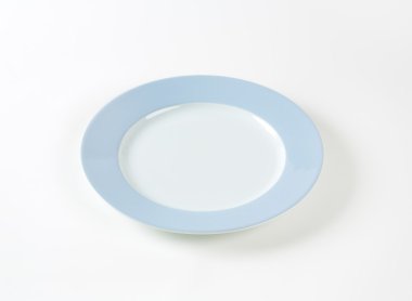 white plate with blue rim