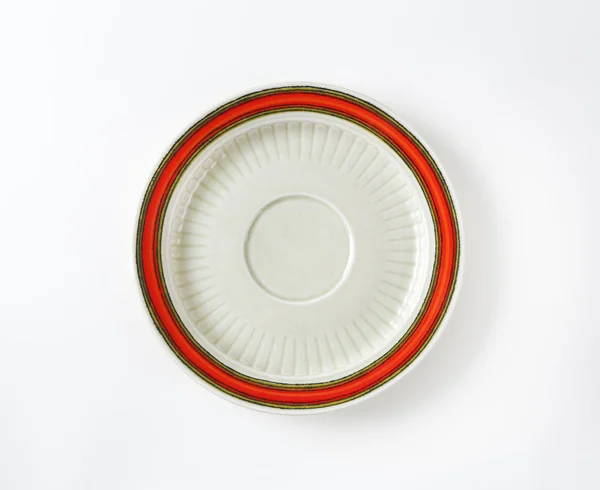 White saucer with red rim — Stock Photo, Image