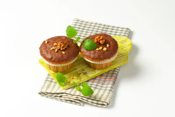 Chocolate glazed muffins — Stock Photo, Image