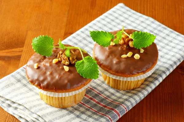 Chocolate glazed muffins — Stock Photo, Image