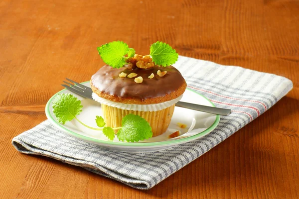 Chocolate glazed muffin — Stock Photo, Image