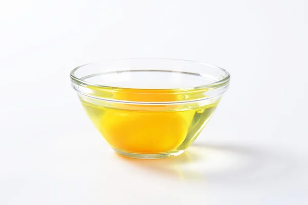 Egg white and yolk in glass bowl — Stock Photo, Image