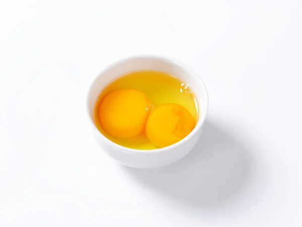 Egg whites and yolks in bowl — Stock Photo, Image