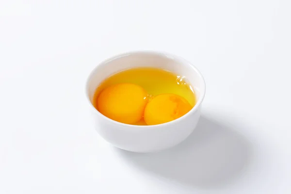 Egg whites and yolks in bowl — Stock Photo, Image