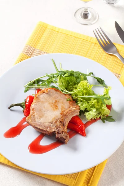 Roast pork chop and accompaniment — Stock Photo, Image