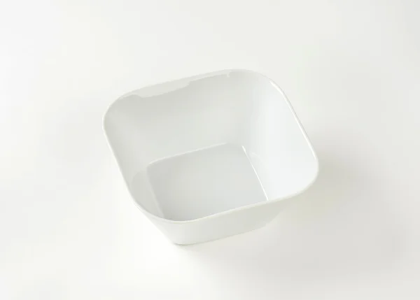 Закруглена квадратна біла чаша — стокове фото