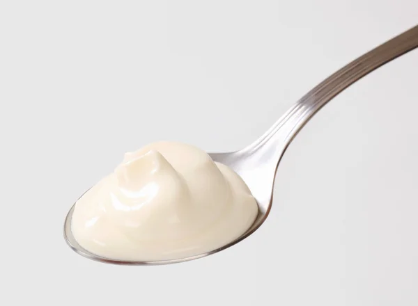 Fresh double cream on a spoon — Stock Photo, Image