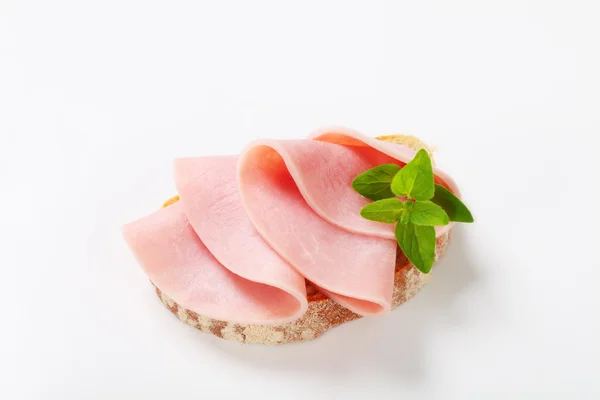 Slice of bread with ham — Stock Photo, Image