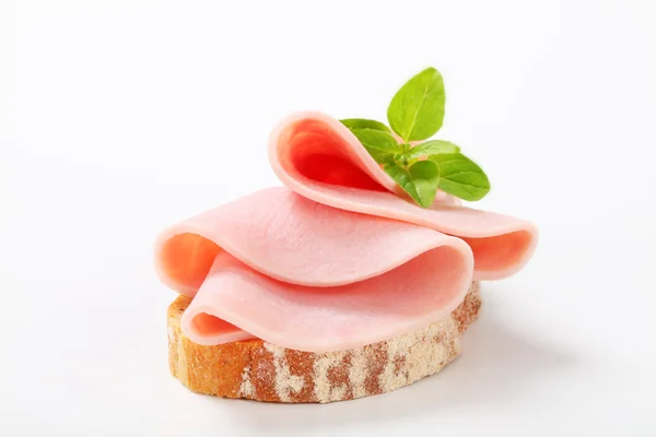 Slice of bread with ham — Stock Photo, Image