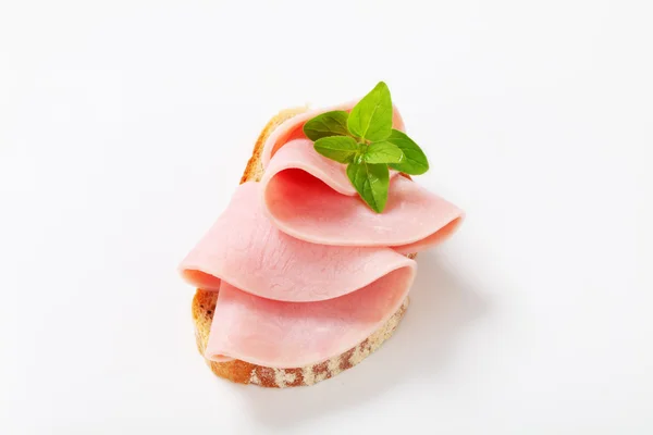 Slice of bread with ham — Stock Photo, Image