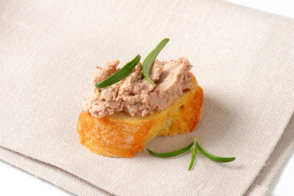 Slice of bread with liver spread — Stock Photo, Image