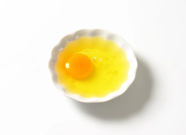 Fresh egg white and yolk in bowl Stock Picture