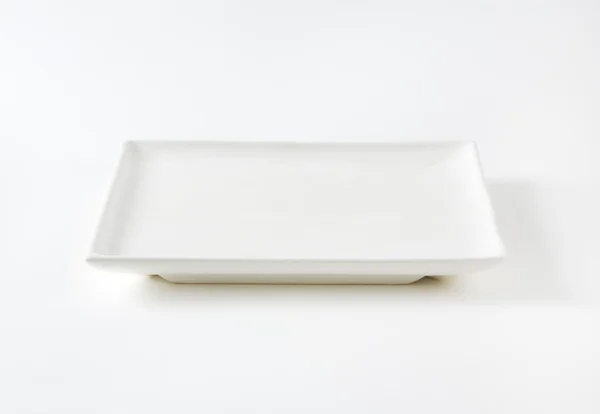 Quadratische weiße Platte — Stockfoto