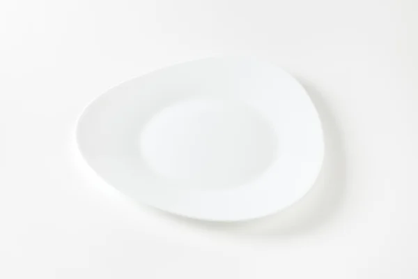 Szeroko oprawie trójkąt biały talerz — Zdjęcie stockowe