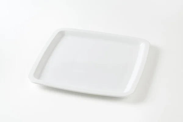 Square white plate Royalty Free Stock Images