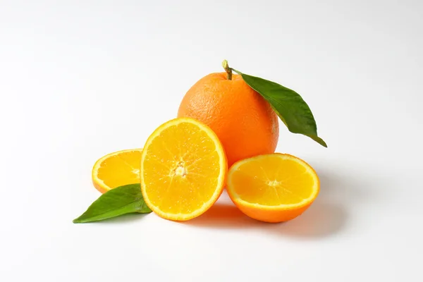 Fresh ripe oranges with leaves — Stock Photo, Image