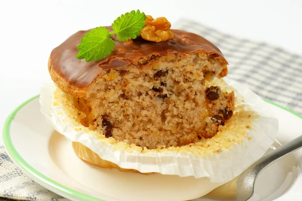 Chocolate glazed walnut muffin — Stock Photo, Image