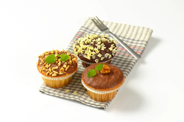 Três muffins variados — Fotografia de Stock