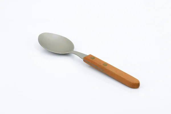 Empty spoon with wooden handle — Stock Photo, Image