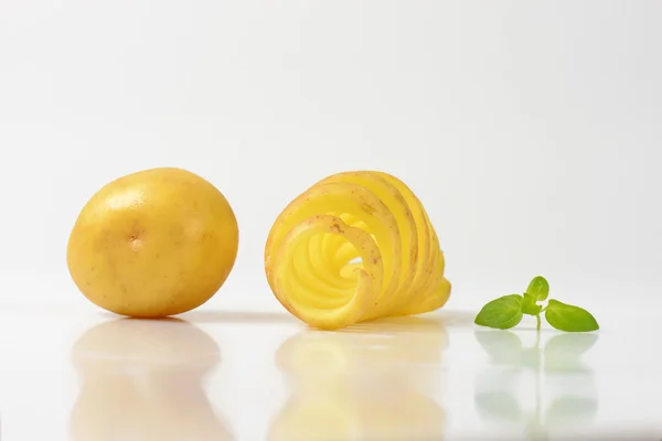 Raw spiral cut potato — Stock Photo, Image