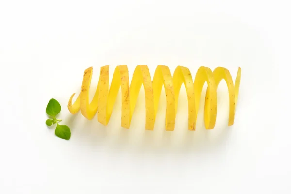Raw spiral cut potato — Stock Photo, Image