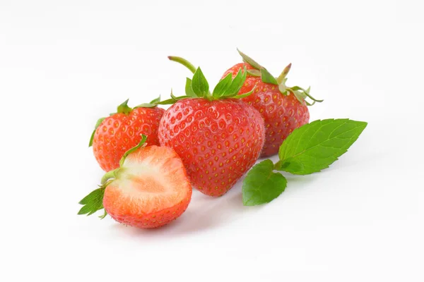 Fresh strawberries - whole and half — Stock Photo, Image