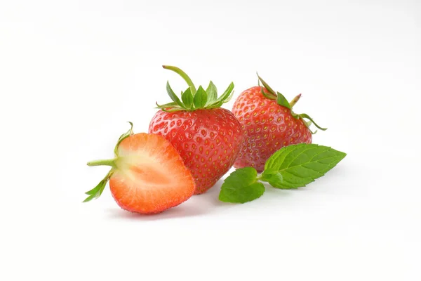 Fresh strawberries - whole and half — Stock Photo, Image