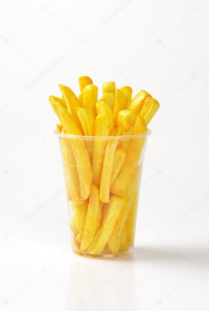 French fries in yellow packaging Stock Photo by ©przemekklos 9353548