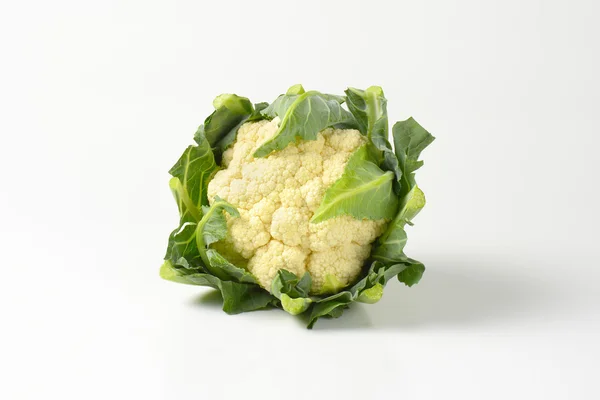 Fresh cauliflower with leaves — Stock Image Fresh cauliflower with leaves Royalty Free Stock Images