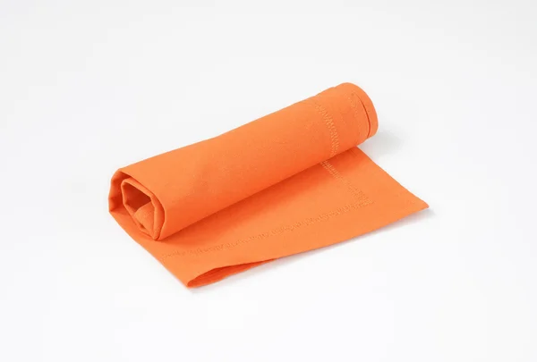 Gerollte orangefarbene Serviette — Stockfoto